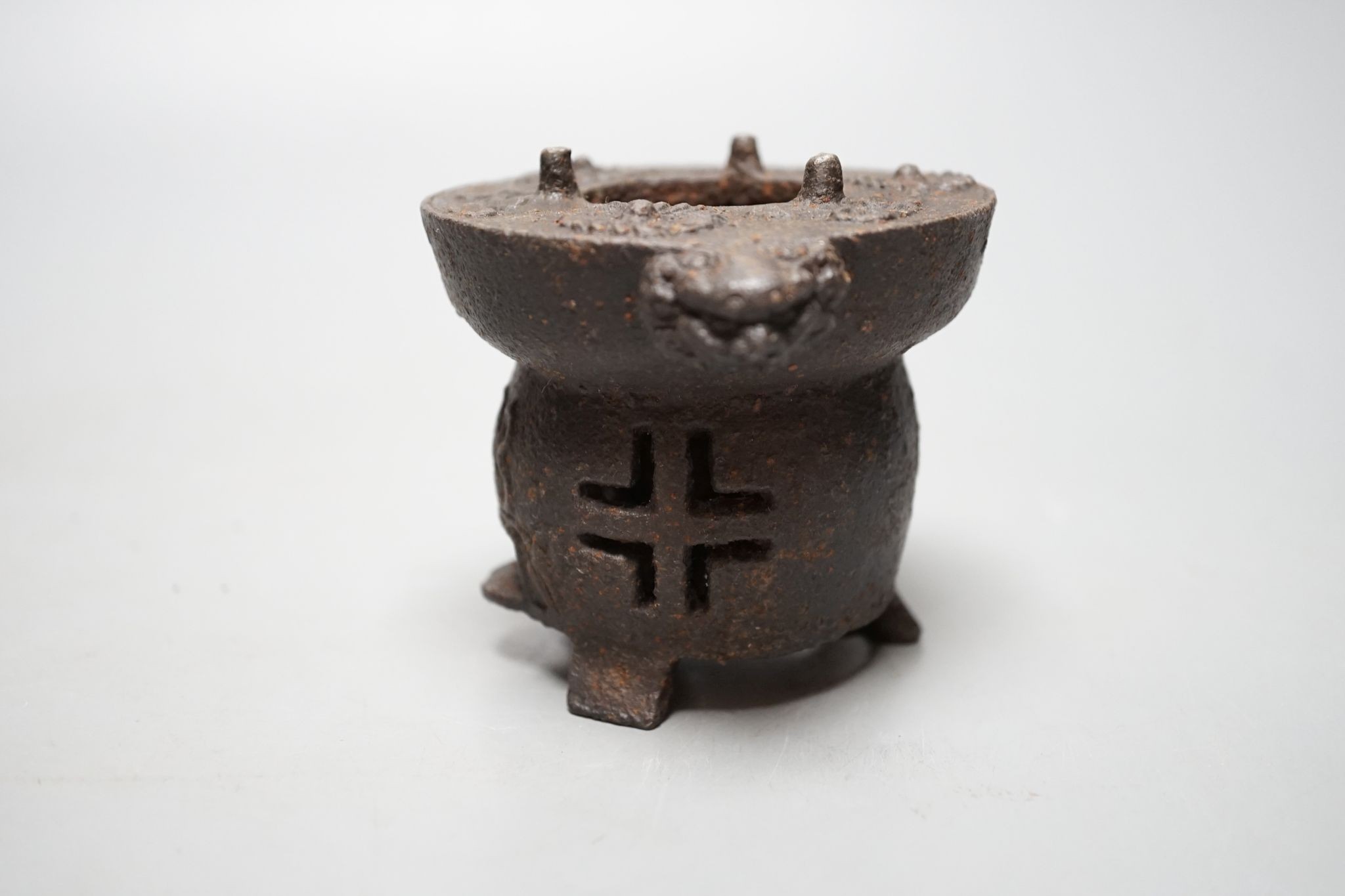A Japanese cast iron burner stand, 6.5 cms high.